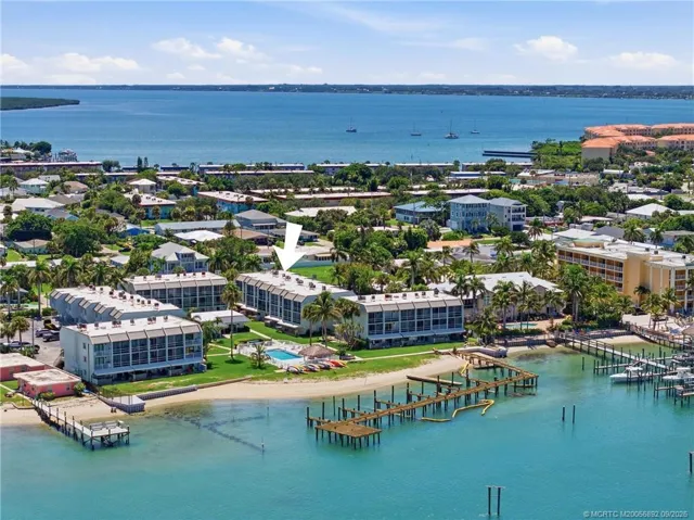 Aerial view with arrow identifying the building within the waterfront community.
