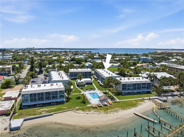 Aerial view with arrow identifying the building within the waterfront community.