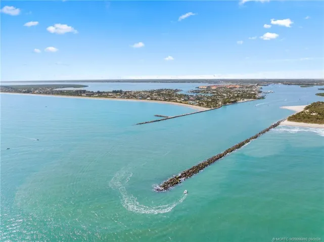 Sweeping aerial perspective captures the inlet, coastline, and expansive waterways surrounding Hutchinson Island.