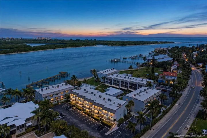 Twilight aerial showcases the community’s waterfront setting along the Intracoastal, with the Atlantic Ocean and Fort Pierce Inlet just beyond.
