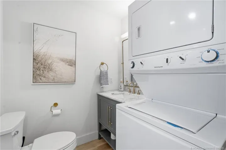 Convenient in-unit laundry is incorporated into the bathroom, with a stacked washer and dryer maximizing the available​​‌​​​​‌​​‌‌​‌‌​​​‌‌​‌​‌​‌​​​‌​​ space.