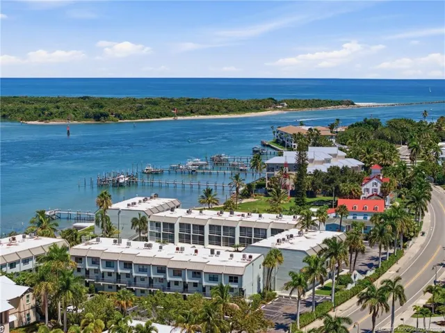 Aerial view highlights the property’s coastal setting near the Fort Pierce Inlet, with the Atlantic Ocean and boating waterways nearby.