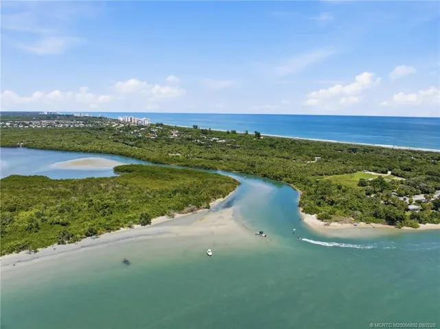 Aerial view of the natural waterways and shoreline near the Fort Pierce Inlet with the Atlantic Ocean beyond.