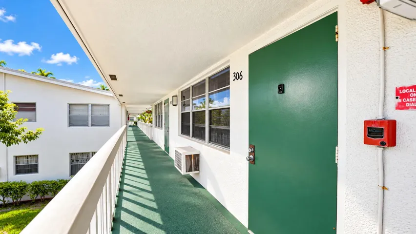 Covered exterior walkway with a contrasting green floor surface