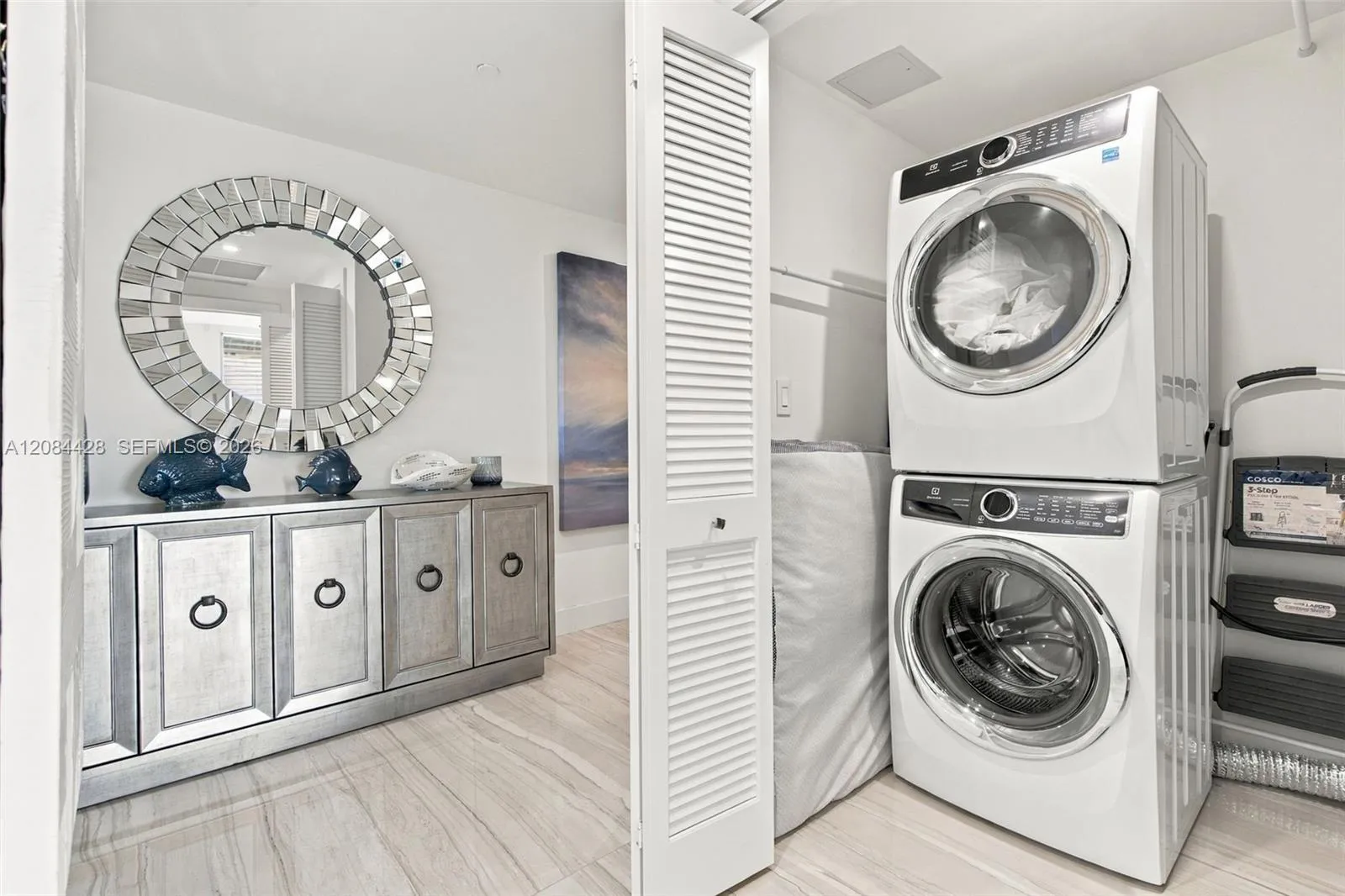 In-unit laundry room with full size washer and dryer.
