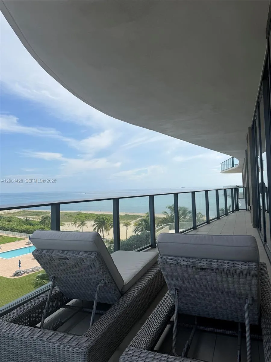 Expansive private balcony overlooking the ocean and coastline.