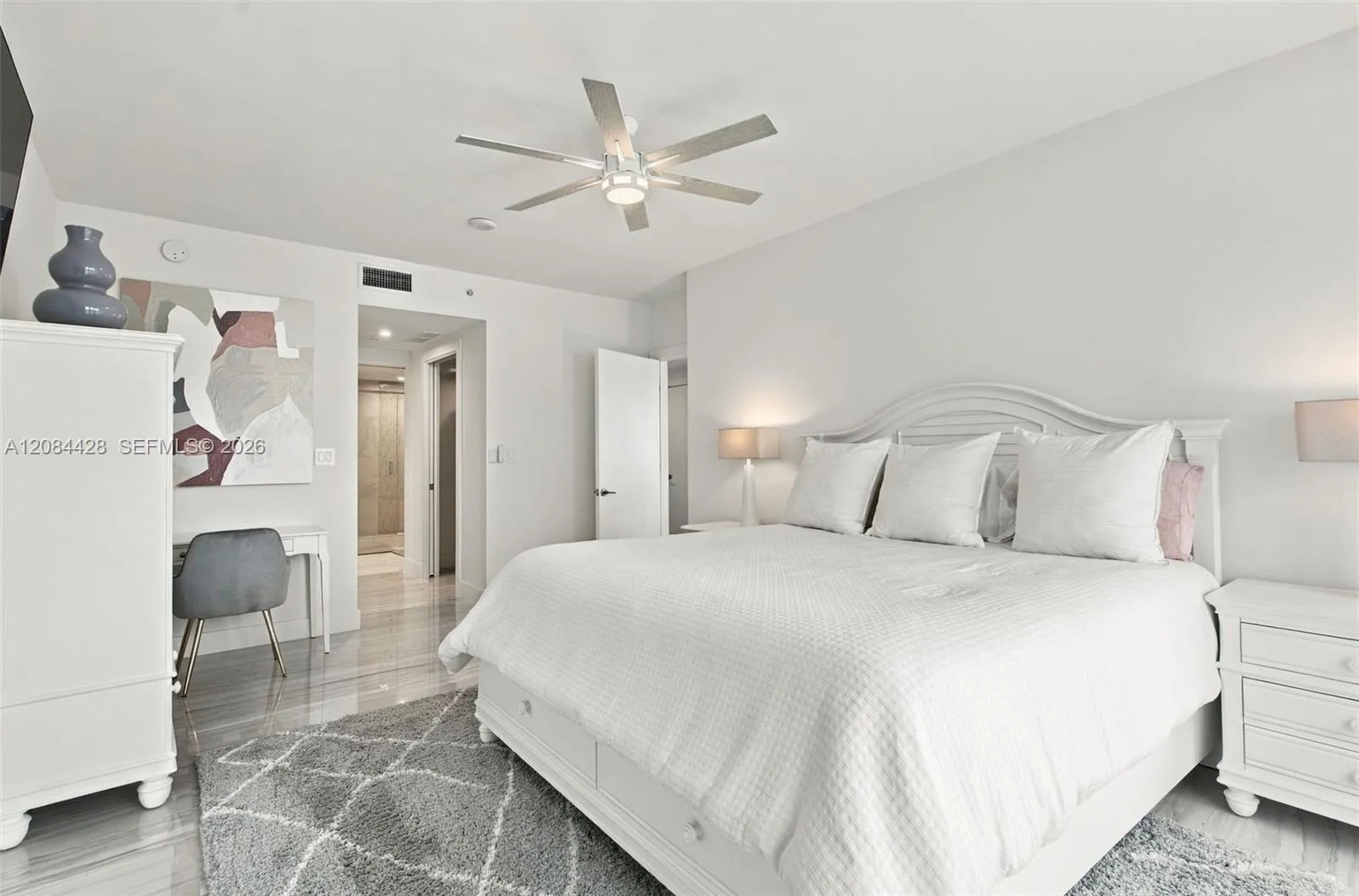 Fully furnished primary suite with a king-size bed.