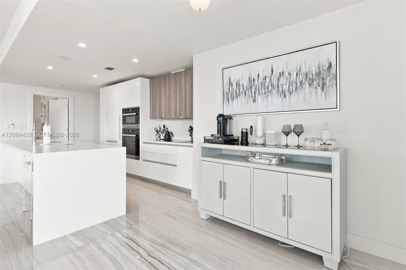 Modern kitchen with sleek cabinetry and built-in appliances.