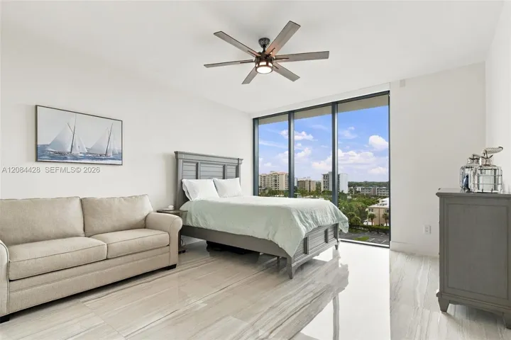 Spacious guest bedroom with a queen-size bed and full-size pullout sofa.