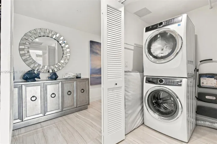 In-unit laundry room with full size washer and dryer.