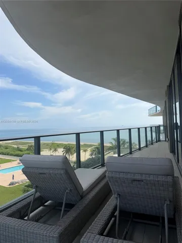 Expansive private balcony overlooking the ocean and coastline.