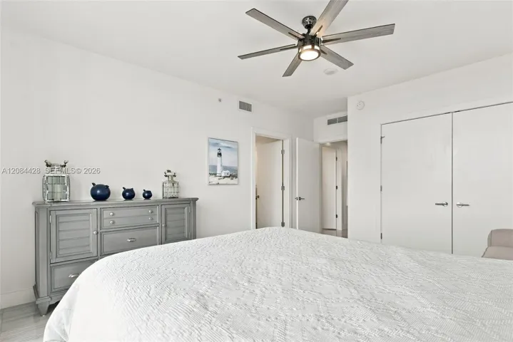 Additional view of the fully furnished guest bedroom. Guest bedroom includes a substantial custom-organized closet.