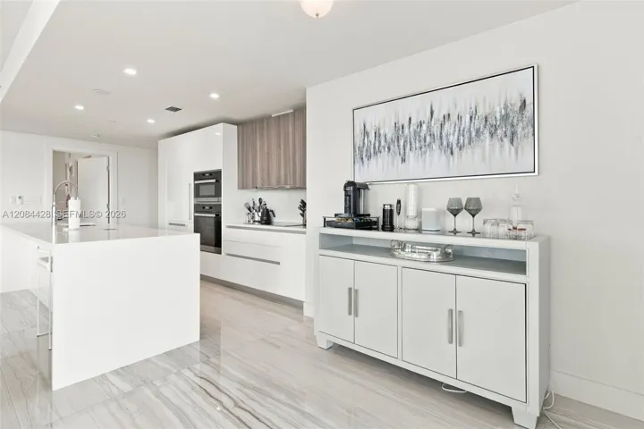 Modern kitchen with sleek cabinetry and built-in appliances.