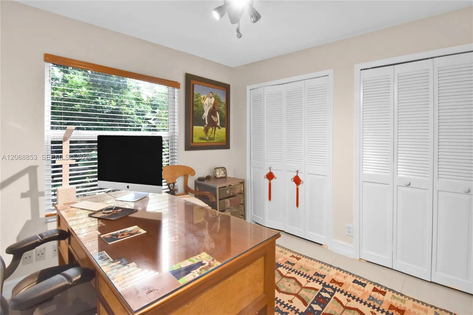 Large bedroom with french doors currently used as an office