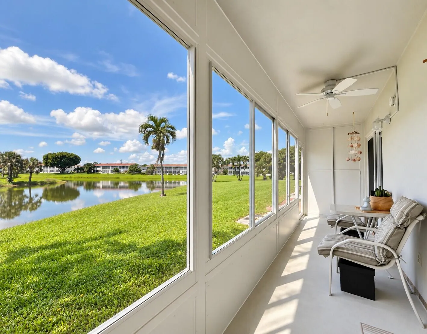 Long Lanai With Updated Impact Windows, Door to Exterior, and Storage Closet