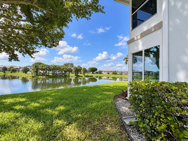 Gorgeous Setting! Pretty & Peaceful Views! CORNER 2/2 With Updated Impact Enclosed Lanai and Impact Windows (Including the Sliders)