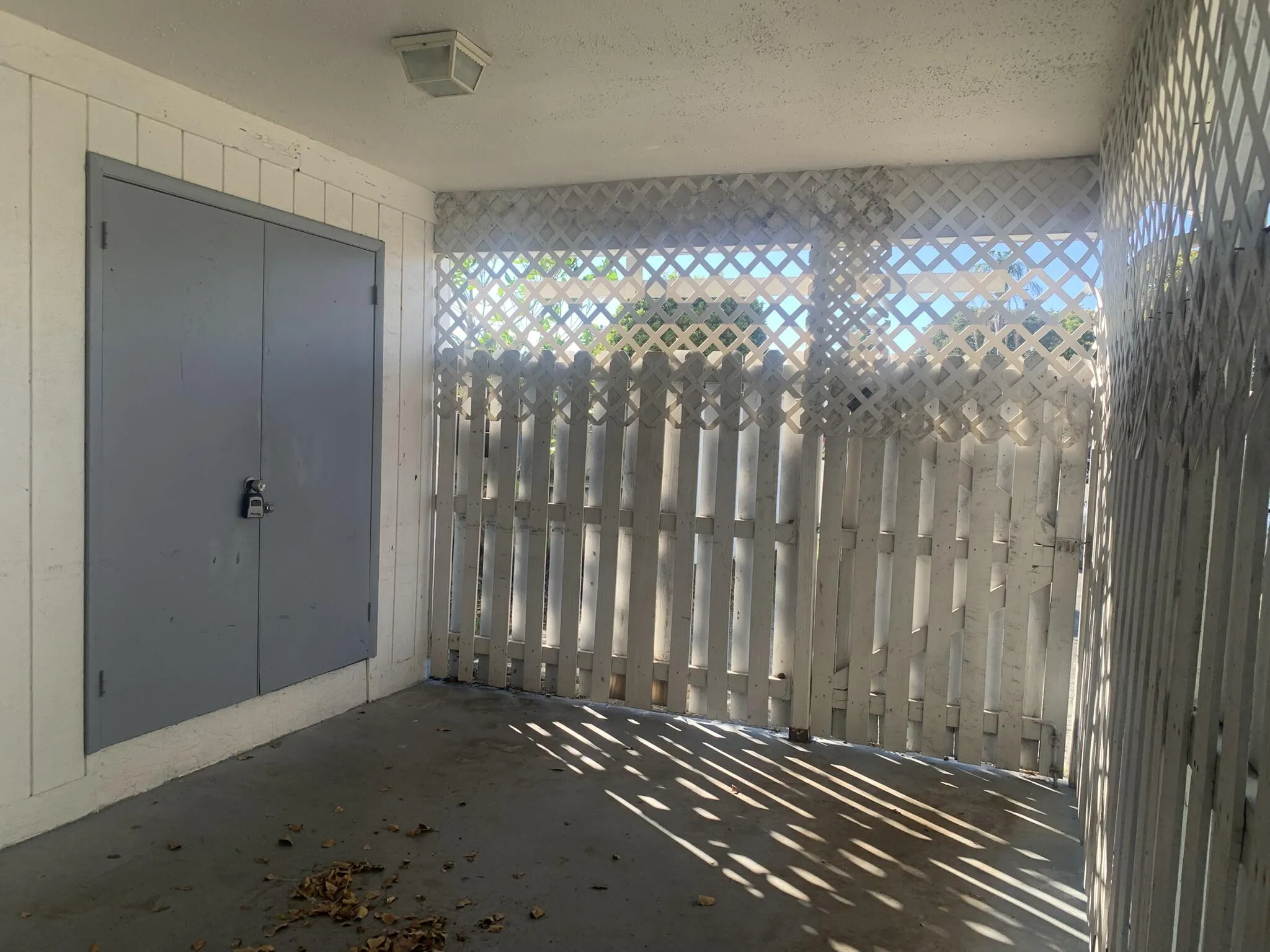 Enclosed carport with plenty of storage