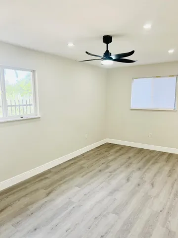 Bedroom 2; warm and bright with two windows