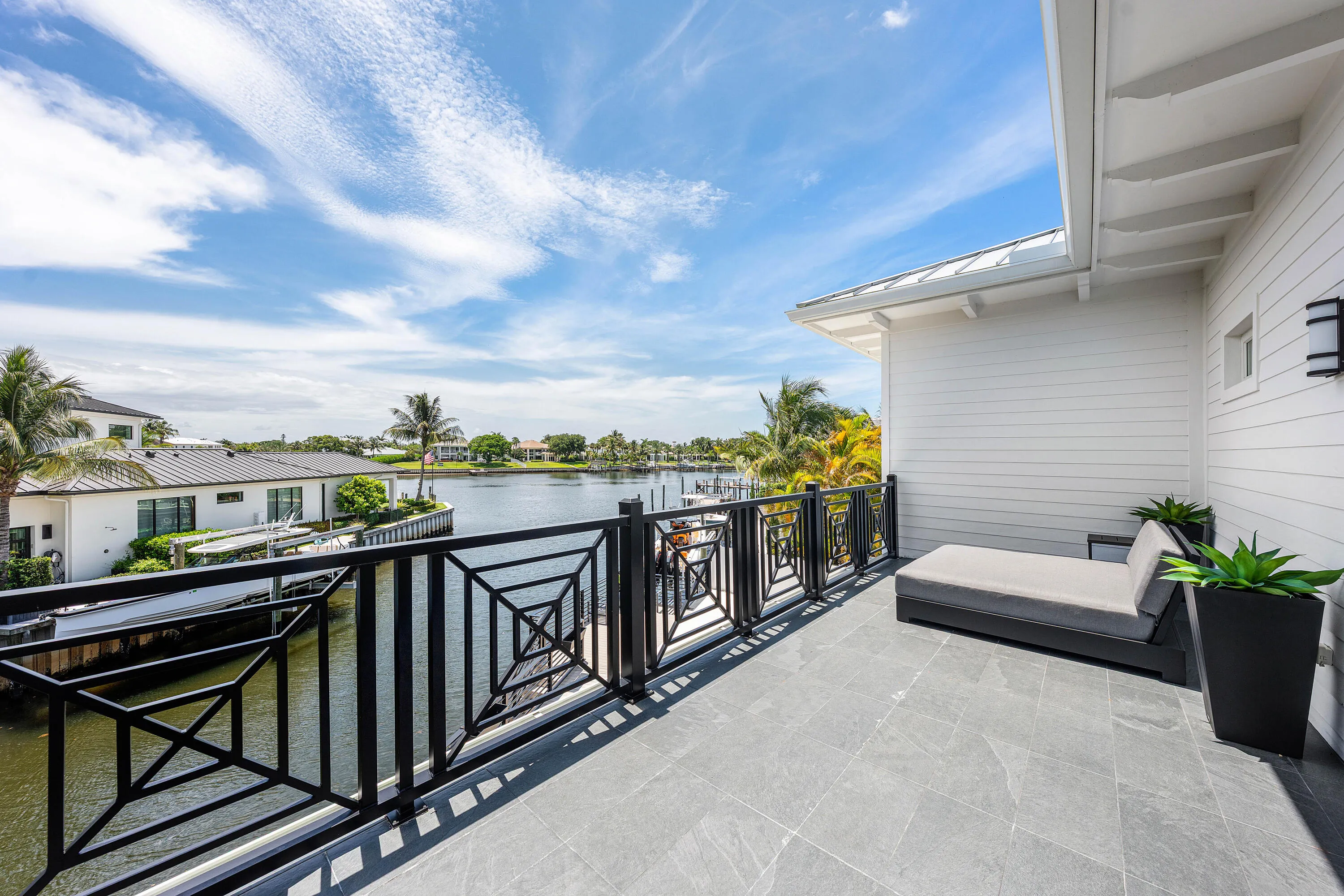 Large waterfront balcony with picturesque views.