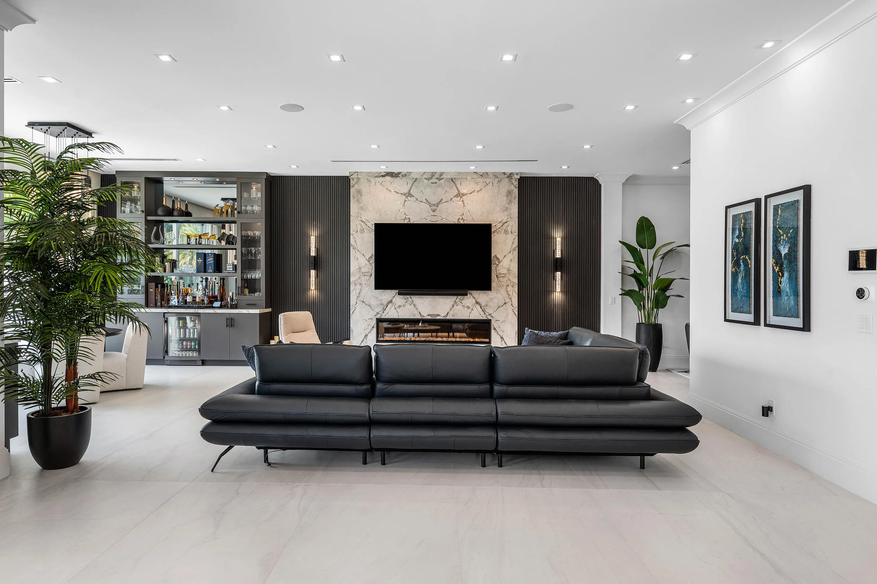 Designer Entertainment Center and Bar with glass-front cabinetry and built-in beverage cooler