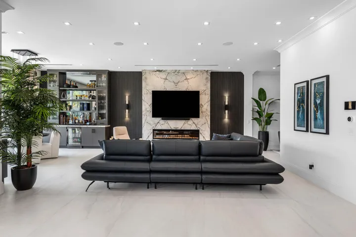 Designer Entertainment Center and Bar with glass-front cabinetry and built-in beverage cooler
