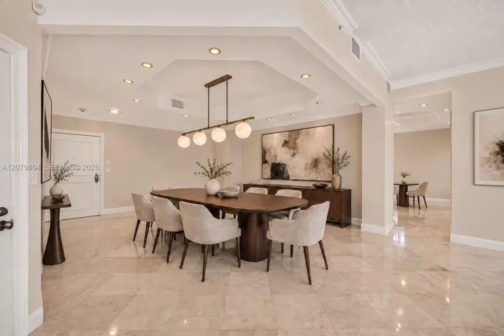 Virtually enhanced photo to visualize the space as a Dining Area, with kitchen behind it