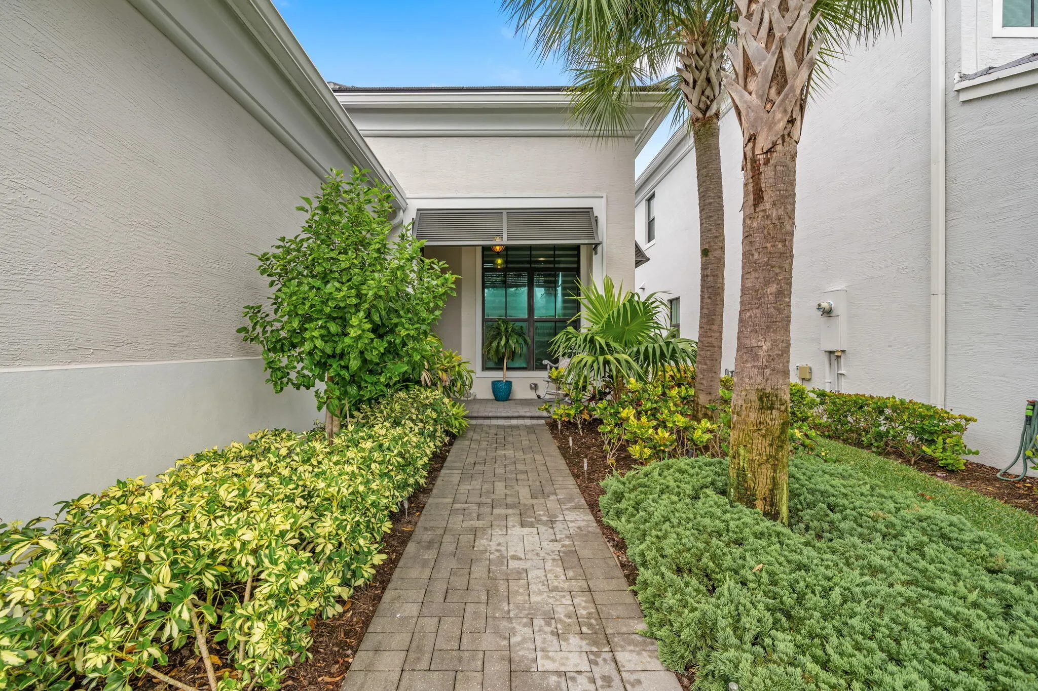 Paver walkway leading to the entry