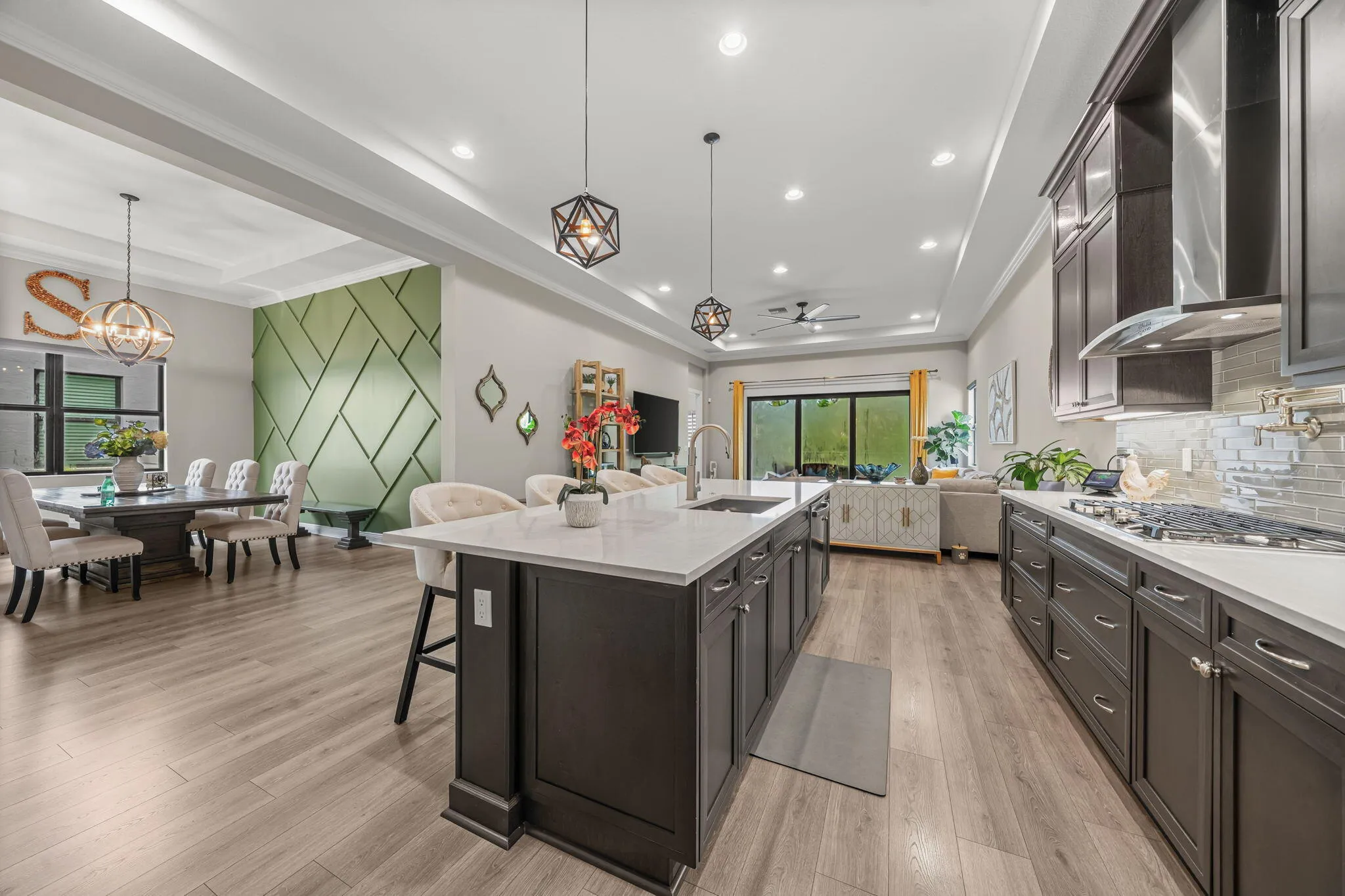 Spacious kitchen with dark wood cabinetry, Quartz countertops, and stainless steel appliances