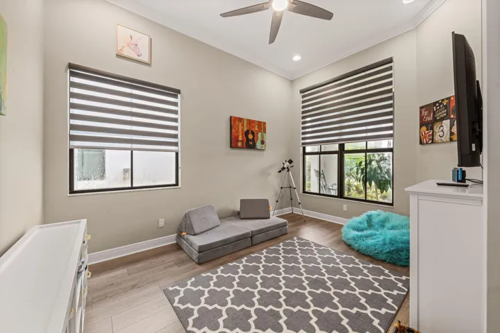 Crown molding and recessed lighting complement the high ceilings