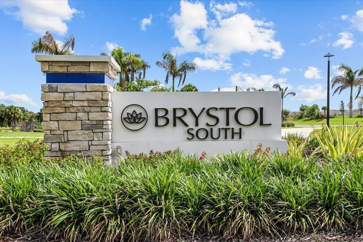 Welcome to Brystol South, a master-planned community featuring elegant stone and stucco architectural elements, mature palm trees, and manicured landscaping with native plantings