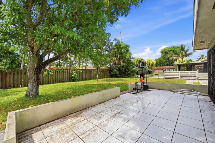 NICE TILED BACK YARD PATIO