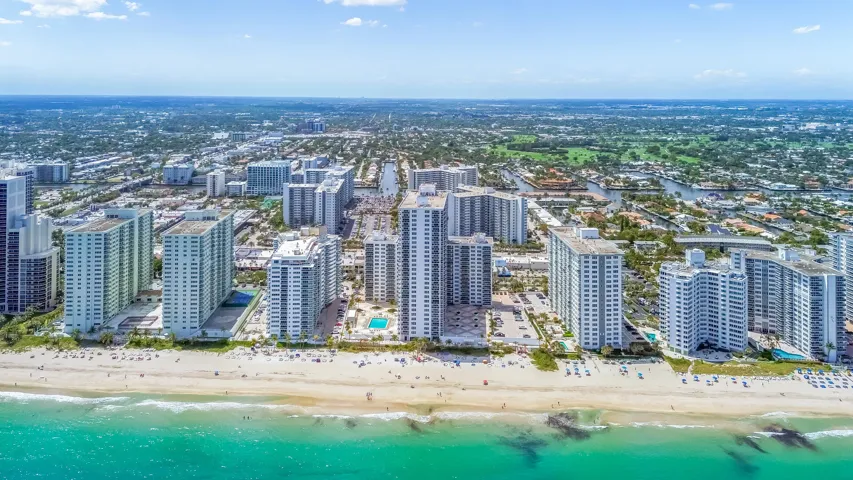 Expansive beach frontage with clear ocean water