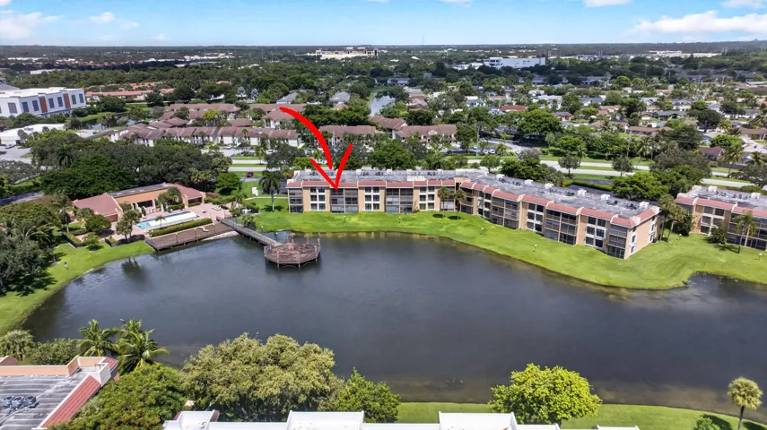 Condominium building situated on a lake with balconies