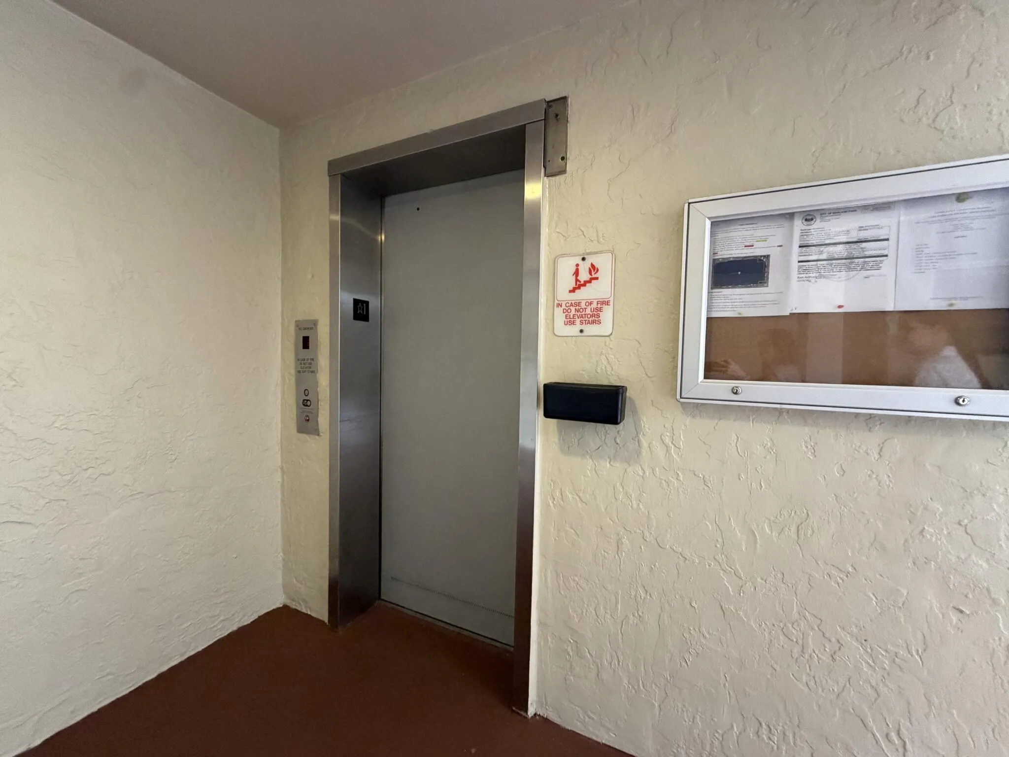 Elevator access with stainless steel door frame and control panel