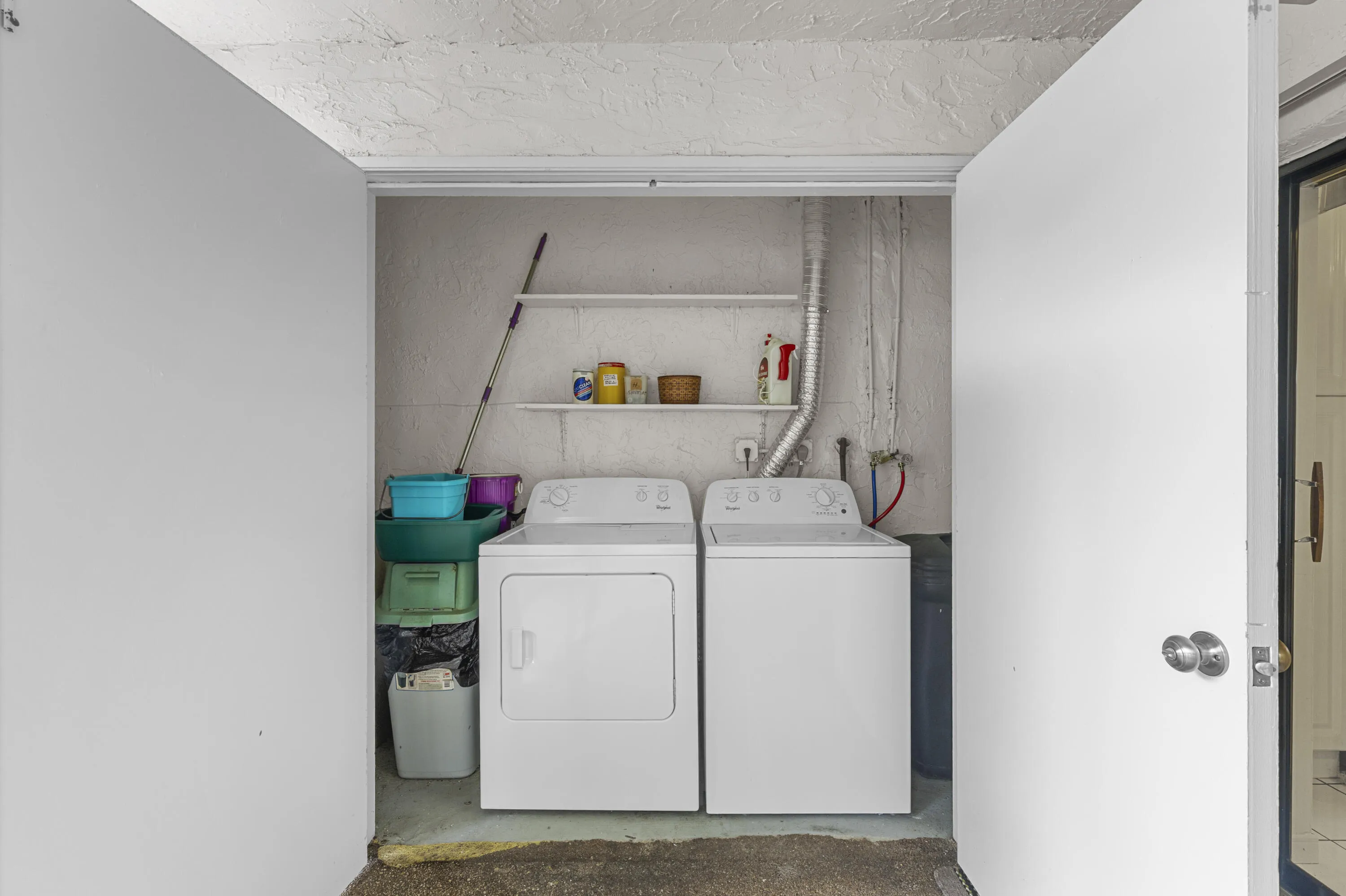 2026 Washer/Dryer and storage on either side.