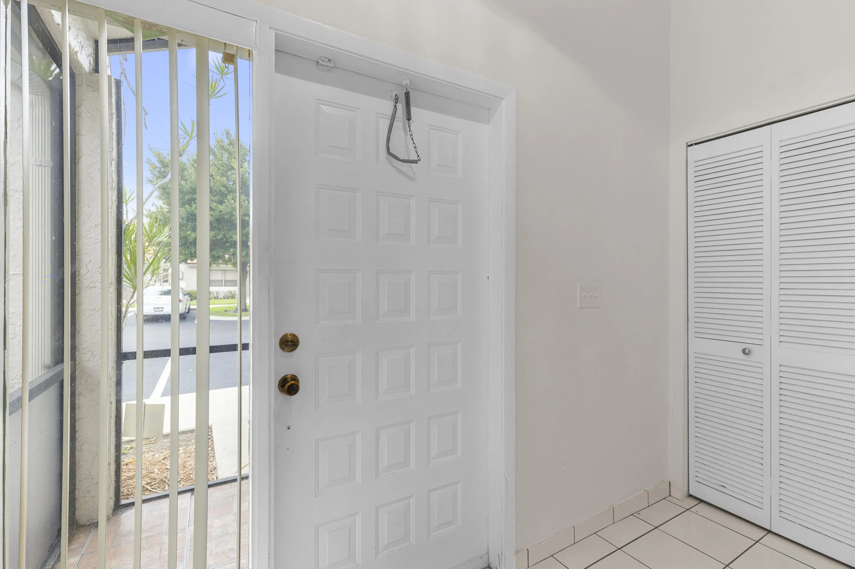 Formal foyer entry with coat/utility closet and a/c water heater closet.