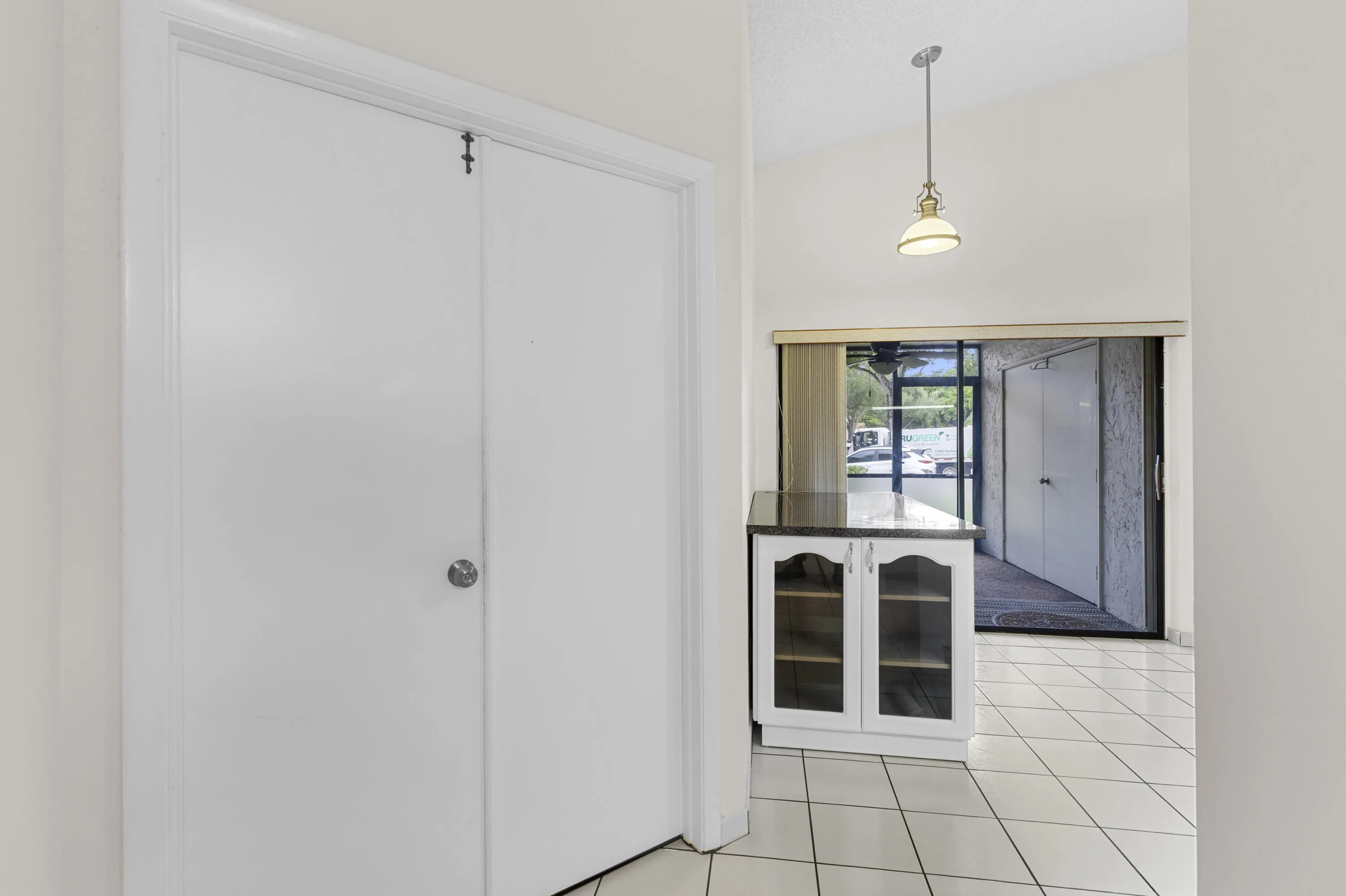 Primary Suite double door entrance- adjacent kitchen