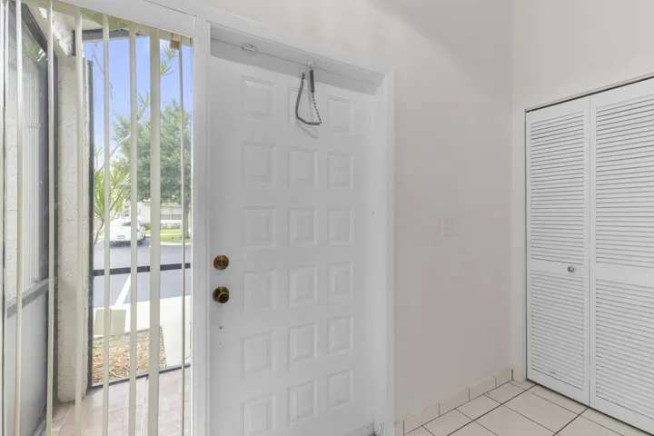 Formal foyer entry with coat/utility closet and a/c water heater closet.