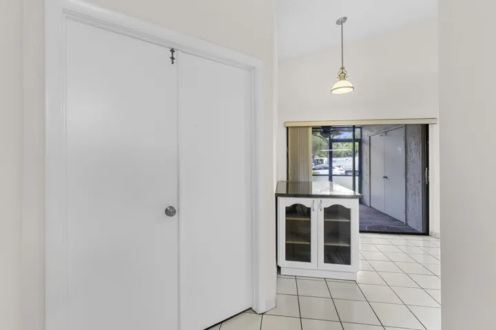 Primary Suite double door entrance- adjacent kitchen