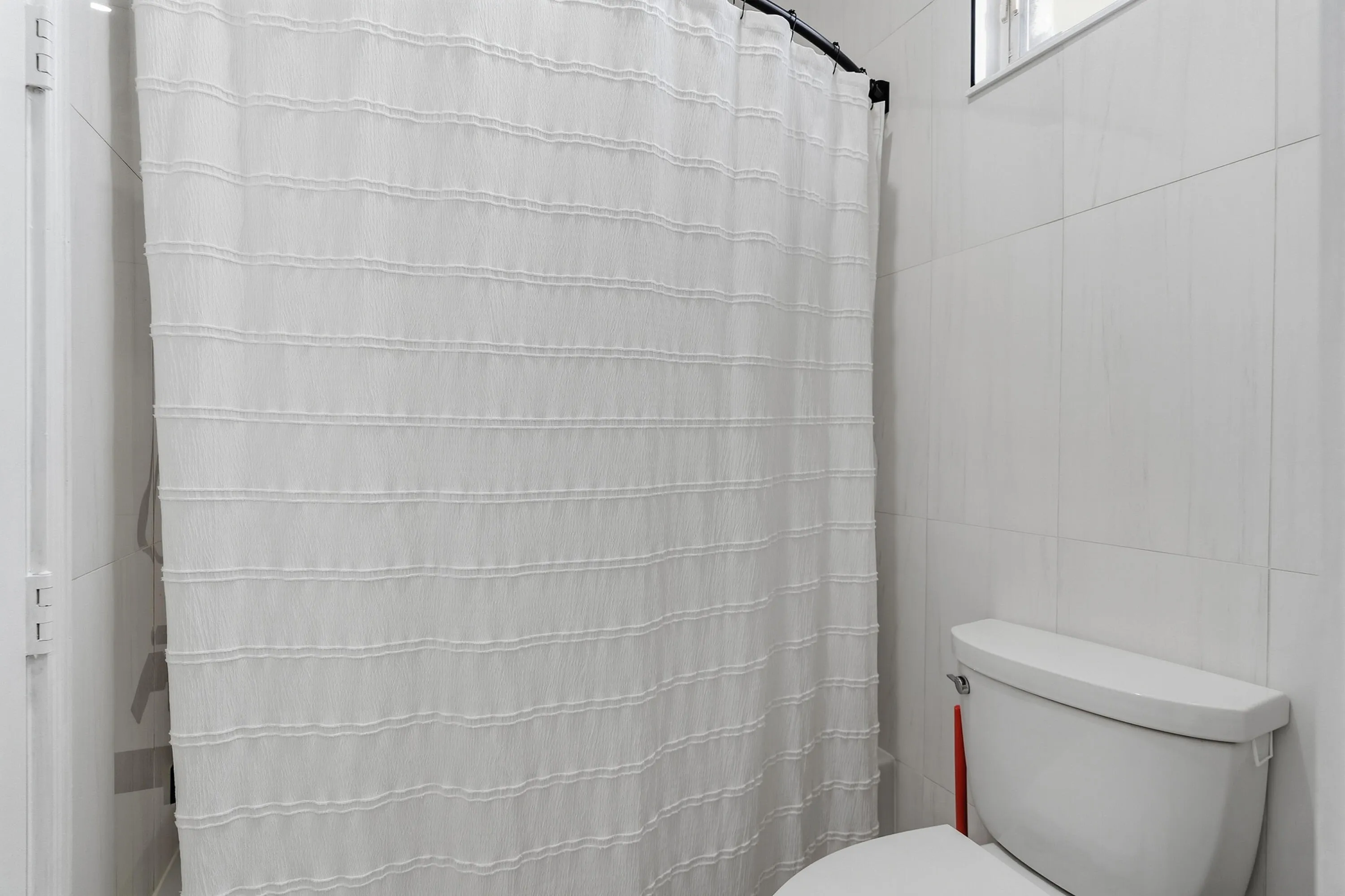 Renovated tub and shower area completes the stylish upstairs bathroom.