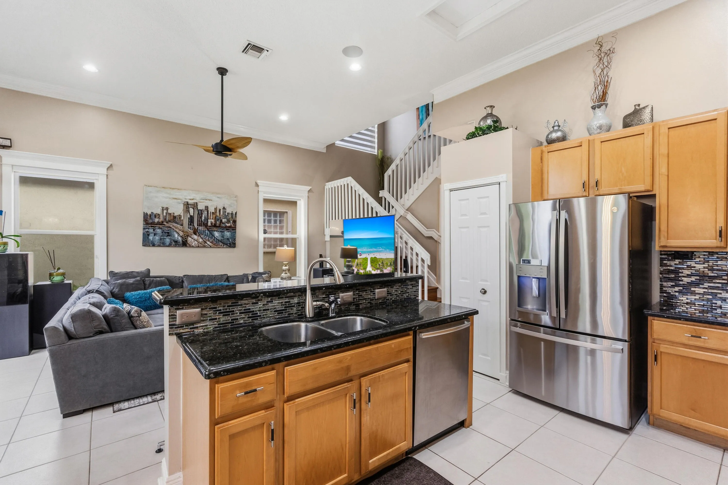 Open connection between the kitchen and family room creates an easy flow for everyday living.