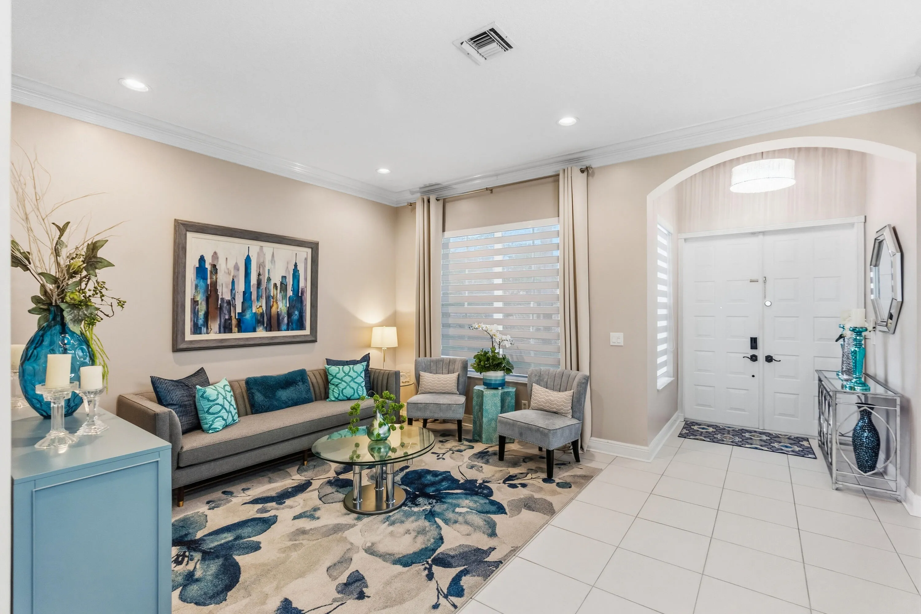 Bright living room offers a comfortable gathering space just off the home’s entry.