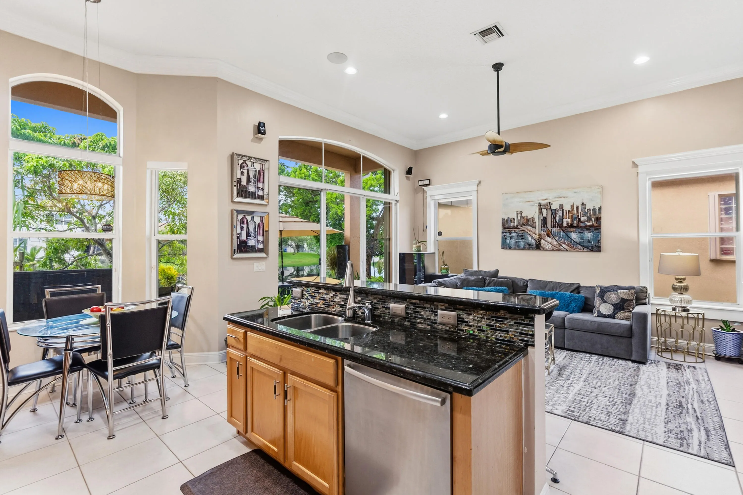 Center island with granite countertops provides additional workspace and convenient prep space.