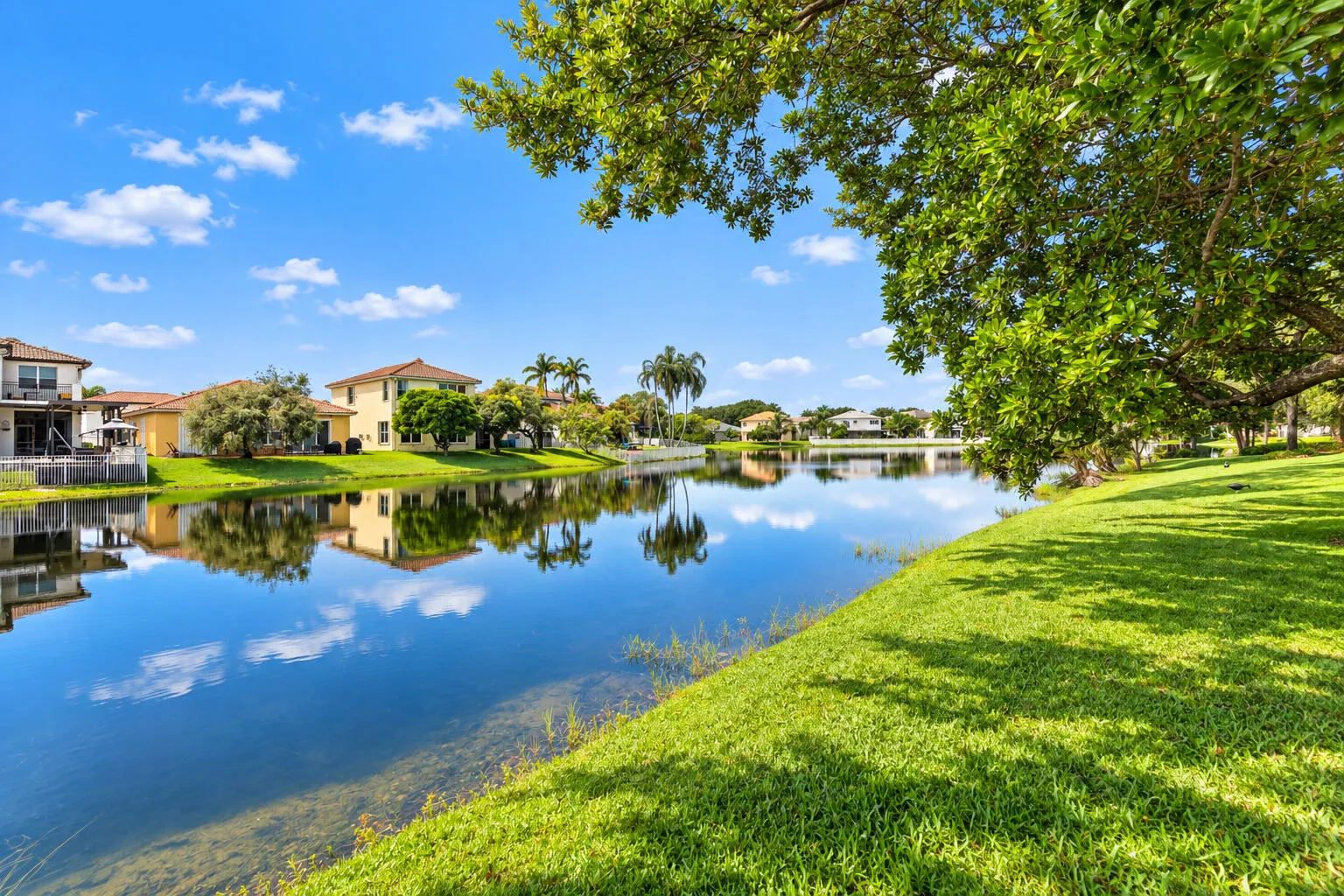 Expansive lake views enhance the home's serene backyard setting.