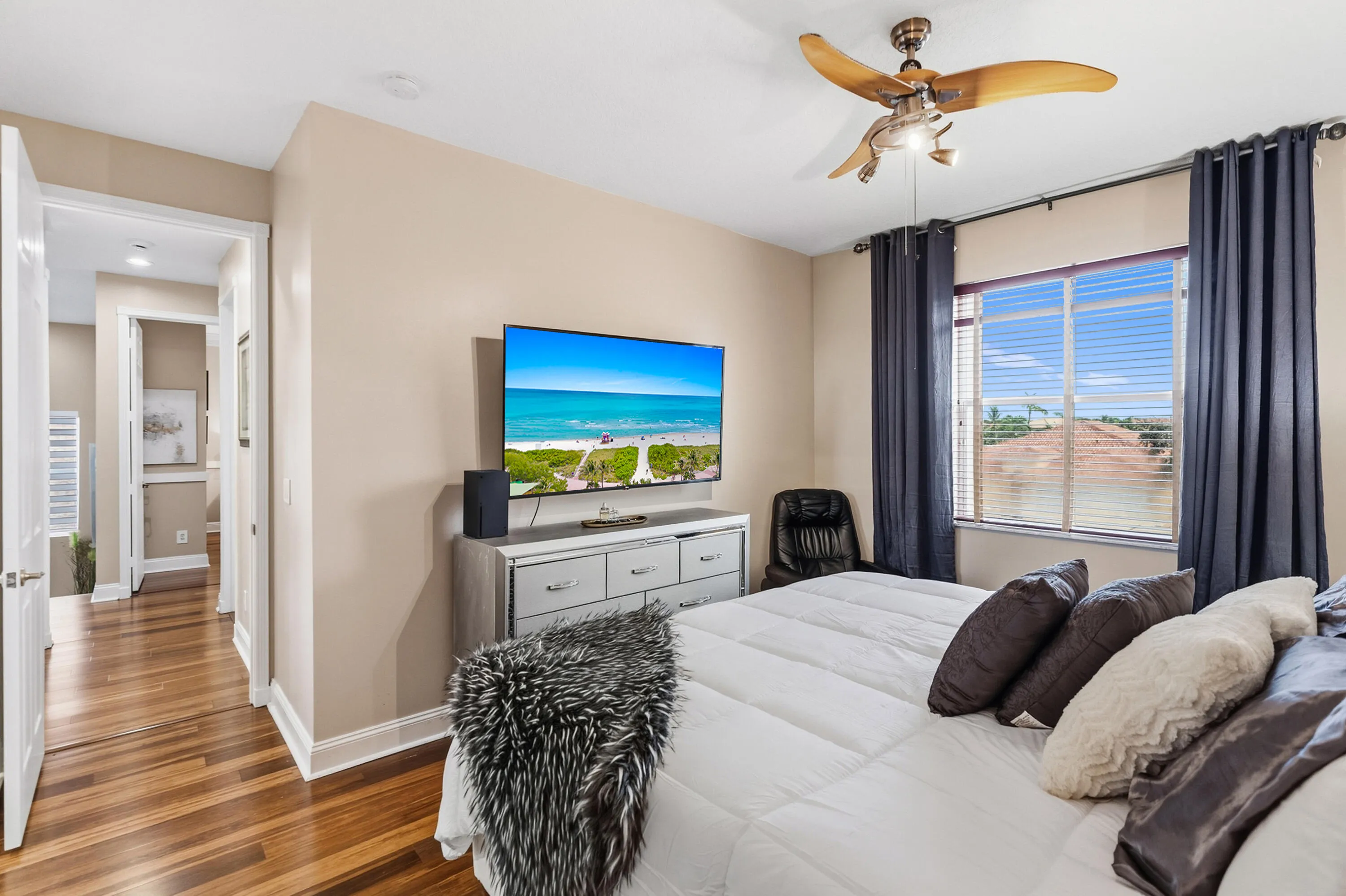 Additional view highlights the bedroom’s generous size and natural light.