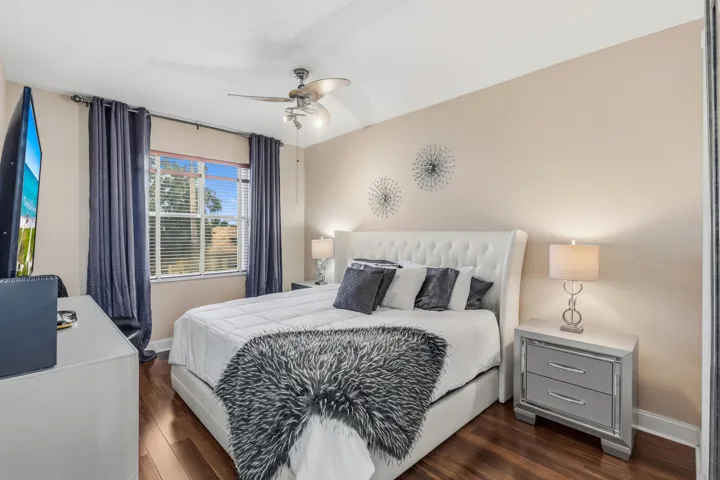 Spacious upstairs bedroom accommodates a king-size bed, has a walk-in closet and direct access to the upstairs bathroom.