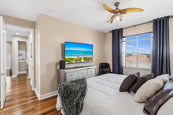 Additional view highlights the bedroom’s generous size and natural light.
