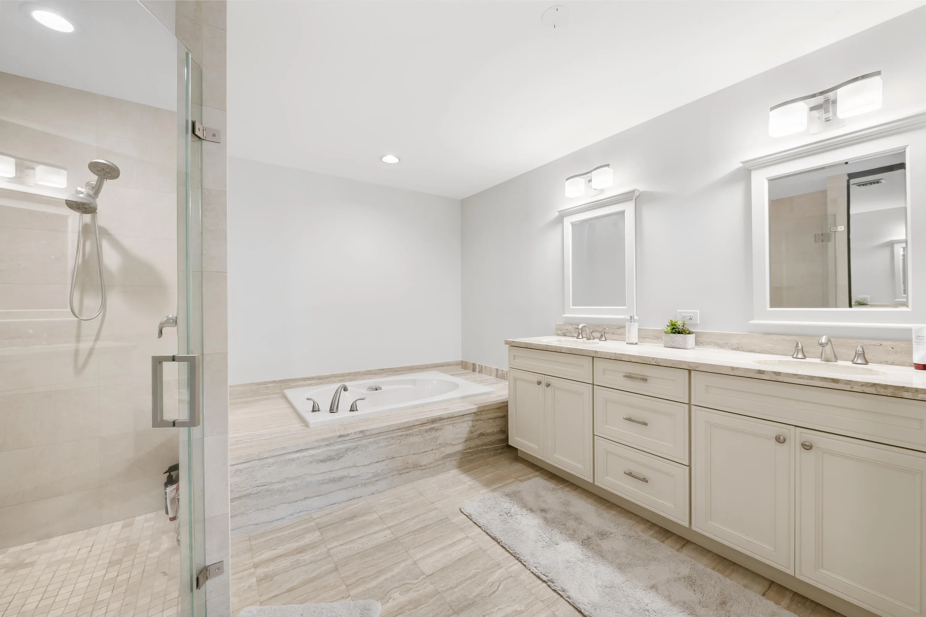 Dual vanity with undermount sinks and light-toned countertops