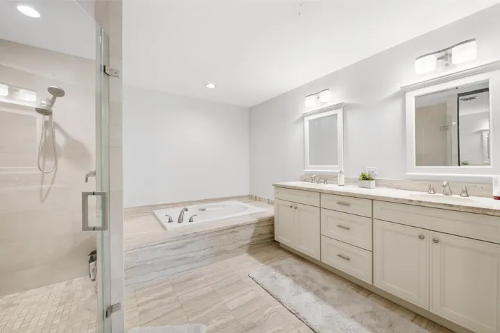 Dual vanity with undermount sinks and light-toned countertops