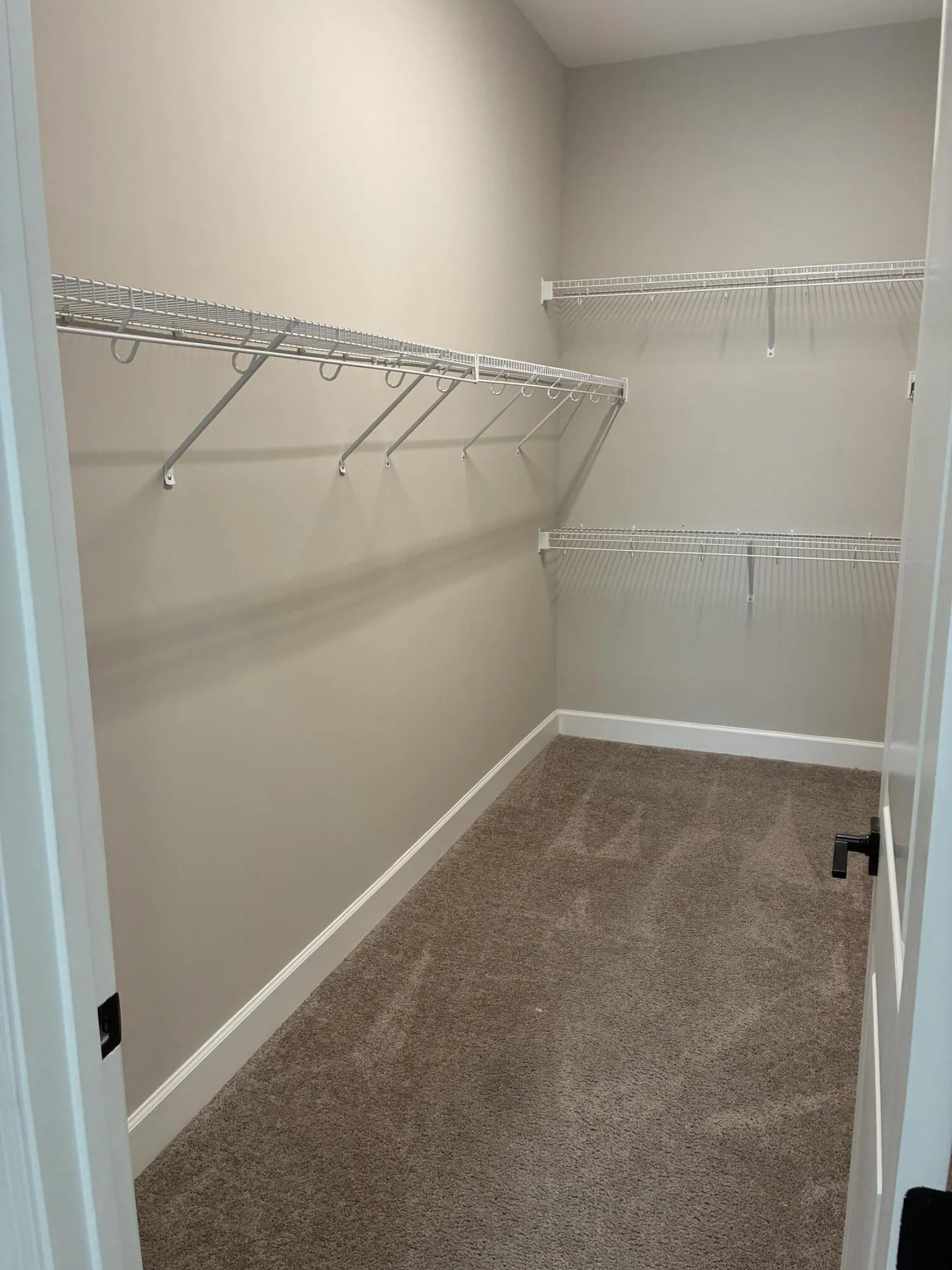 Master closet with shelving on both side